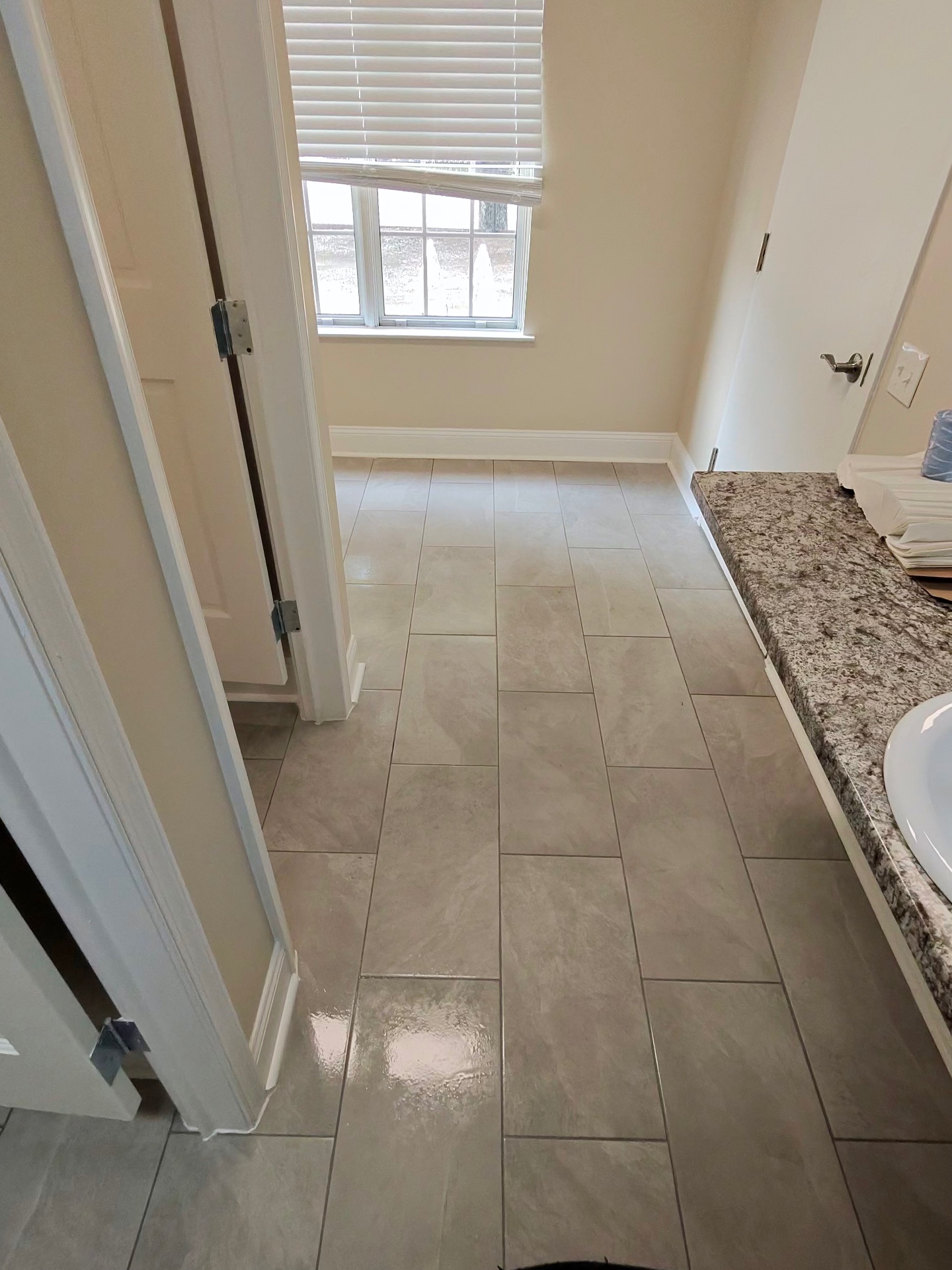 Sparkling clean tiled bathroom floor after a professional cleaning