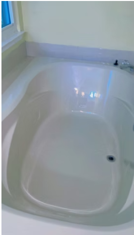 Spotless white bathtub after a deep cleaning