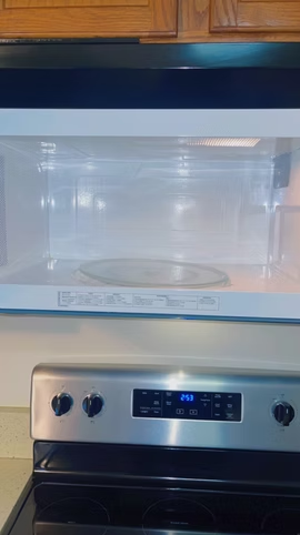 Clean microwave interior above a stainless steel range